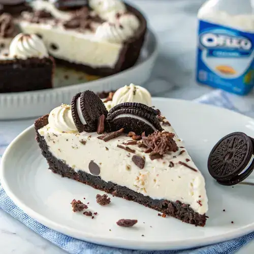 A decadent no-bake Oreo cream pie slice with whipped cream and Oreo crumbs, set against a blurred background of baking ingredients.