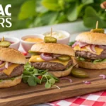 A close-up of BIG MAC SLIDERS with special sauce, cheese, lettuce, pickles, and onions on toasted buns.