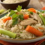 A delicious serving of slow cooker chicken and rice with vegetables and parsley garnish.