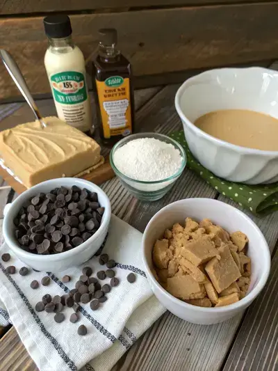 Ingredients for Peanut Butter Chocolate Bars arranged on a kitchen table.